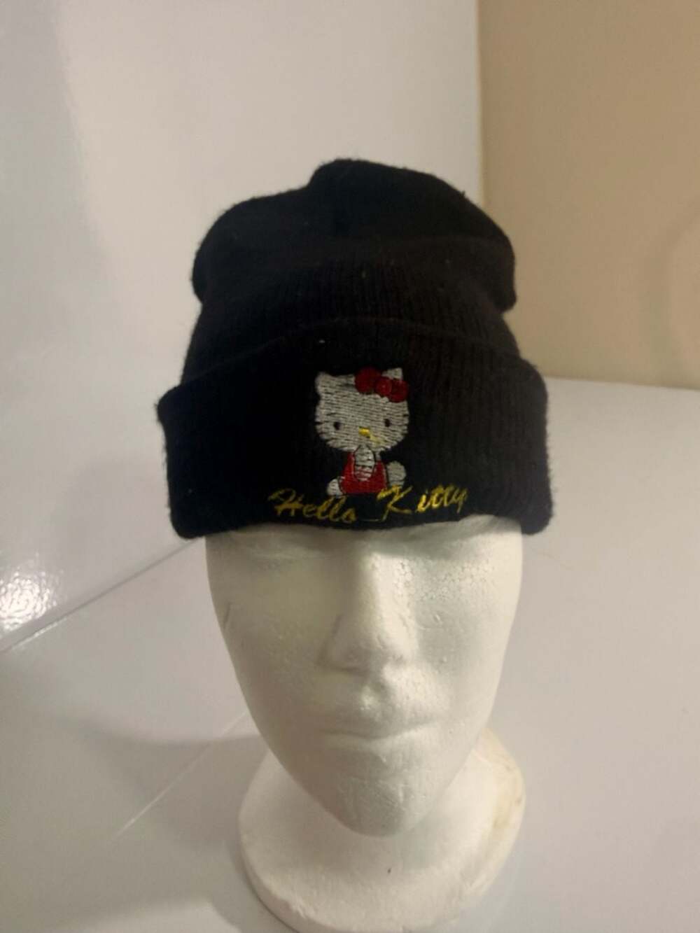 Sanrio Hello Kitty Black Knit Beanie with Embroidered Graphic and Gold Logo
